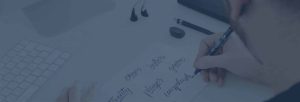 Graphic designer at JKC Media working on a brand identity design