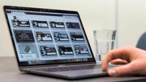 The JKC Media website shown on a laptop