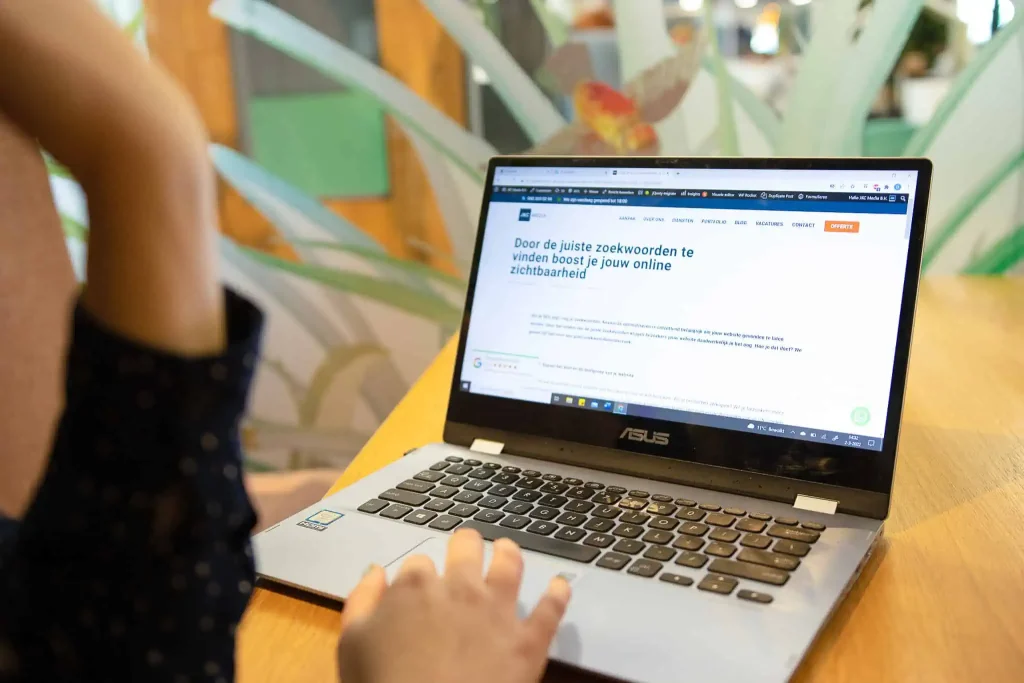 JKC Media copywriter writing a blog post at a desk