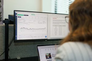 Working on SEO behind a computer while defining a target audience at JKC Media