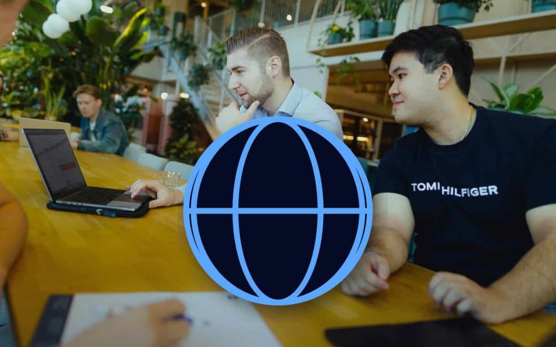JKC colleagues in a meeting, with a large globe icon: matching tone of voice per market to your audience