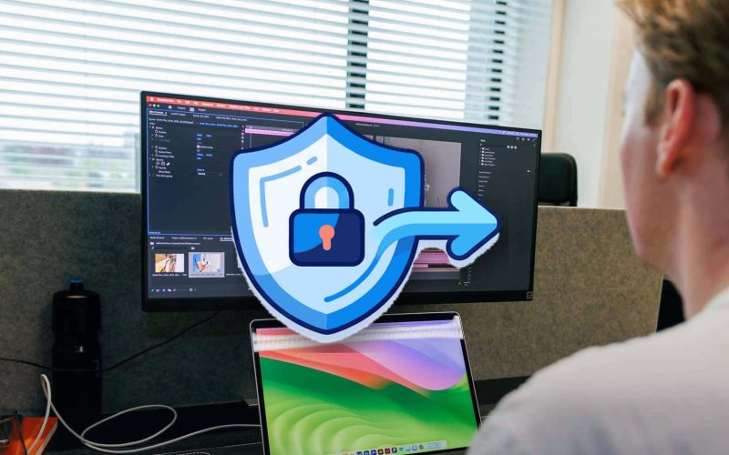 Workstation with multiple screens at JKC Media, with a large shield and lock icon: WordPress security and information security