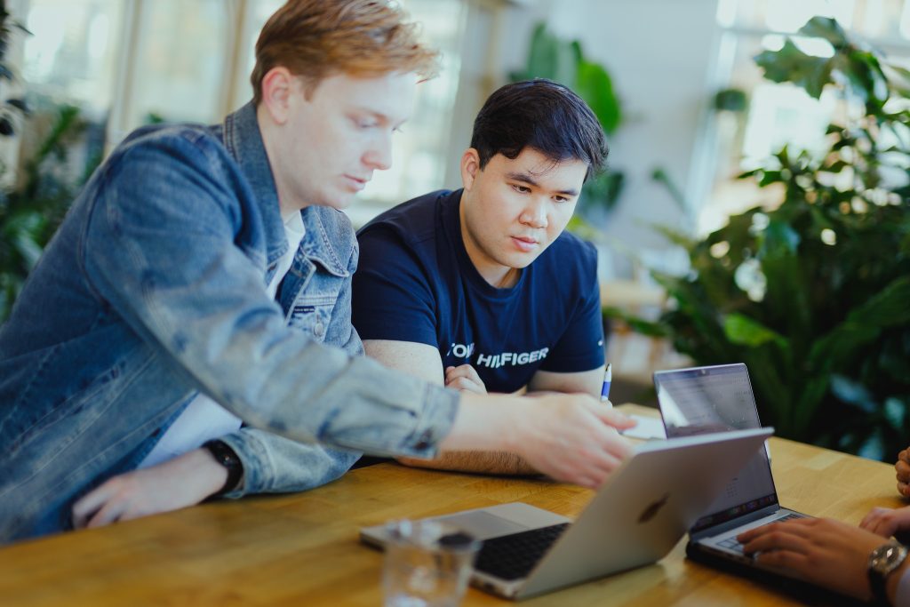 Two colleagues working together on a laptop