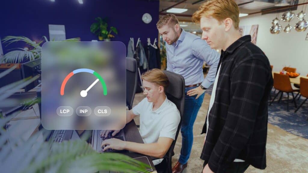 Core Web Vitals: JKC colleagues checking a website together, with a speed gauge and the labels LCP, INP and CLS