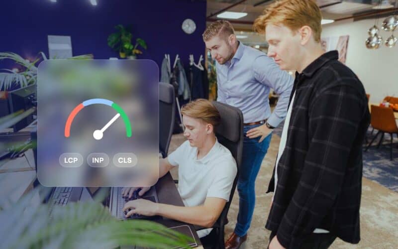 Core Web Vitals: JKC colleagues checking a website together, with a speed gauge and the labels LCP, INP and CLS