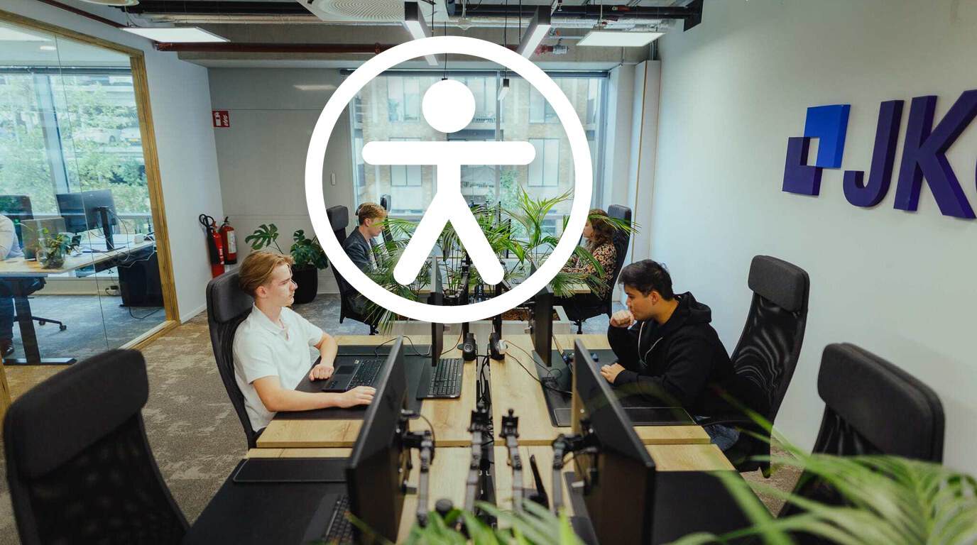 Digital accessibility: the JKC team at work in the office with an accessibility icon