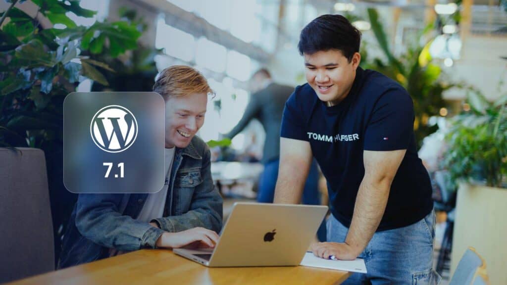 WordPress 7: two JKC Media colleagues at a laptop with the WordPress logo and version 7.1