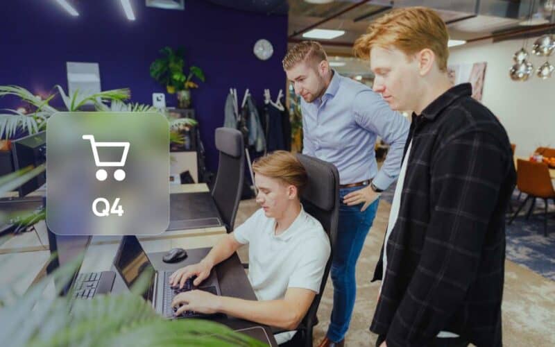 Optimise your webshop for Q4: JKC colleagues looking at a webshop together, with a shopping cart icon and the label Q4